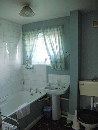 The old bathroom before the re-fit, with a coloured suite